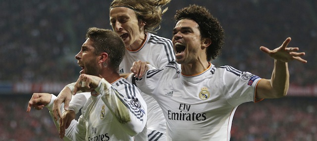 Real's Sergio Ramos is congratulated by his teammates Luka Modric and Pepe, from left, as he celebrates scoring his side's 2nd goal during the Champions League semifinal second leg soccer match between Bayern Munich and Real Madrid at the Allianz Arena in Munich, southern Germany, Tuesday, April 29, 2014. (AP Photo/Matthias Schrader)