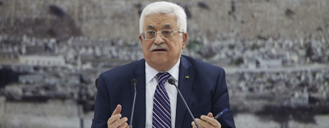 Palestinian President Mahmoud Abbas talks during a leadership meeting in Ramallah, Tuesday, April 1, 2014. In a dramatic move that could derail eight months of U.S. peace efforts, President Abbas resumed a Palestinian bid for further U.N. recognition despite a promise to suspend such efforts during nine months of negotiations with Israel. Abbas signed "State of Palestine" applications for 15 U.N. agencies in a hastily convened ceremony after Israel calls off a promised prisoner release. (AP Photo/Majdi Mohammed)