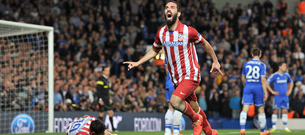 Atletico Madrid's Turkish midfielder Arda Turan celebrates scoring his team's third goal during the UEFA Champions League semi-final second leg football match between Chelsea and Atletico Madrid at Stamford Bridge in London on April 30, 2014. AFP PHOTO / GLYN KIRK (Photo credit should read GLYN KIRK/AFP/Getty Images)