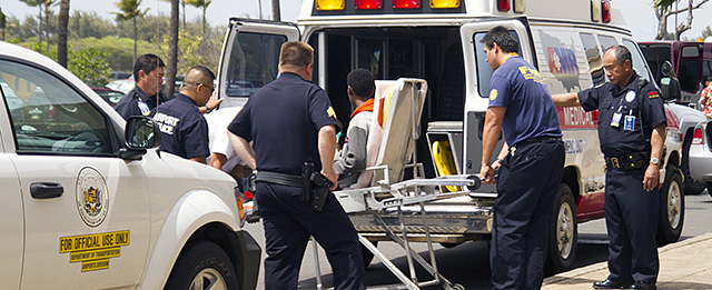 A 16-year-old boy who stowed away in the wheel well of a flight from San Jose, Calif., to Maui, on stretcher at center, is loaded into an ambulance at Kahului Airport in Kahului, Maui, Hawaii Sunday afternoon, April 20, 2014. Officials say the boy is "lucky to be alive" and unharmed, surviving cold temperatures at 38,000 feet and a lack of oxygen. (AP Photo/The News, Chris Sugidono)