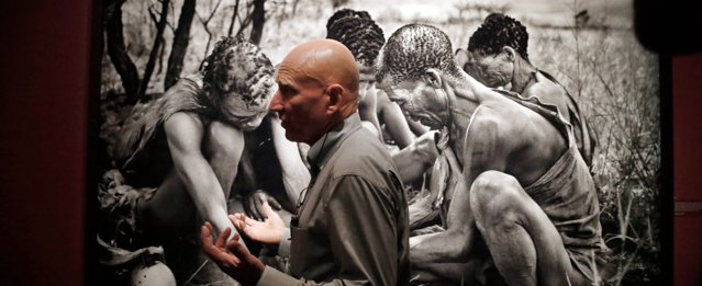 Brazilian photographer Sebastiao Salgado leads a tour of his exhibition "Genesis" on Thursday, April 24, 2014, at the National Museum of Singapore. His latest collection of 245 black-and-white photographs taken around the world, untainted by modern life is part of Salgado's premiere solo showcase in Asia. (AP Photo/Wong Maye-E)