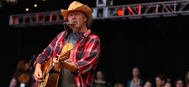 Neil Young performs at the Bridge School Benefit Concert at the Shoreline Amphitheatre on Saturday, Oct. 20, 2012, in Mountain View, Calif. (Photo by Barry Brecheisen/Invision/AP)