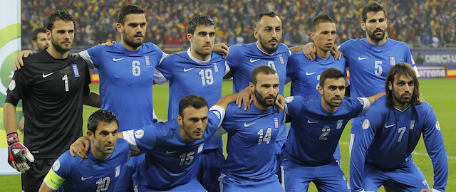 Greek national football team's (from top L to bottom R) goalkeeper Orestis-Spyridon Karnezis, Alexandros Tziolis, Socratis Papastathopoulos, Konstantinos Mitroglou, Jose Holebas, Dimitrios Siovas, Georgios Karagounis, Vasileios Torosidis, Dimitrios Salpingidis, Ioannis Maniatis and Georgios Samaras pose on November 19, 2013 in Bucharest before the FIFA 2014 World Cup playoff football match Romania vs Greece. AFP PHOTO/ DANIEL MIHAILESCU (Photo credit should read DANIEL MIHAILESCU/AFP/Getty Images)