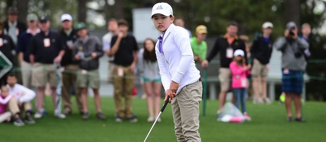 Lucy Li from Redwood City, California (Girls 10-11 category) reacts after sinking her putt on the 18th hole during the National Finals of the 2014 Drive, Chip and Putt Championships, April 6, 2014 at Augusta National Golf Club Augusta, Georgia. The championships was created by the Masters Tournament Foundation, United States Golf Association (USGA) and The PGA of America. AFP PHOTO/Emmanuel Dunand (Photo credit should read EMMANUEL DUNAND/AFP/Getty Images)