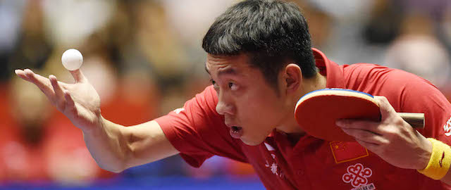 TOKYO, JAPAN - MAY 02: Xin Xu of China serves against Stefen Fegerl of Austria during day five of the 2014 World Team Table Tennis Championships at Yoyogi National Gymnasium on May 2, 2014 in Tokyo, Japan. (Photo by Atsushi Tomura/Getty Images)