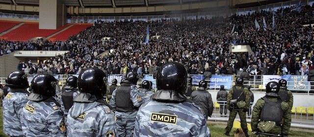 MOSCOW, RUSSIA - NOVEMBER 22: Russian riot police OMON keep Zenit Saint Petersburg fans under control after the Russian Football League Championship match between FC Spartak Moscow and FC Zenit Saint Petersburg at the Luzhniki Stadium on November 22, 2008 in Moscow, Russia. (Photo by Dima Korotayev/Epsilon/Getty Images)