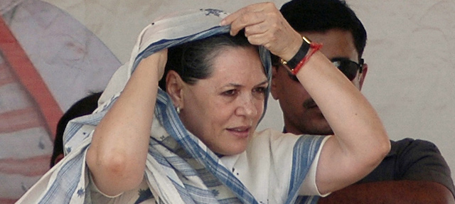 Congress party President Sonia Gandhi adjusts her sari during an election campaign rally in Halol, about 150 kilometers (94 miles) from Ahmadabad, India, Friday, April 24, 2009. With more than 700 million voters, India is holding a five-phased election, for logistic and security reasons, ending May 13. (AP Photo/Ajit Solanki)