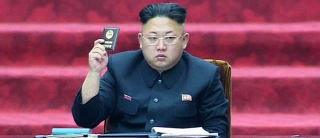 In this Wednesday, April 9, 2014 image made from video, North Korean leader Kim Jong Un holds up parliament membership certificate during the Supreme People's Assembly in Pyongyang, North Korea. North Korea's newly-selected parliament met for the first time on Wednesday in Pyongyang. It was the first time that North Korea has reassembled its parliament under new leader Kim. (AP Photo/KRT via AP Video) TV OUT, NORTH KOREA OUT