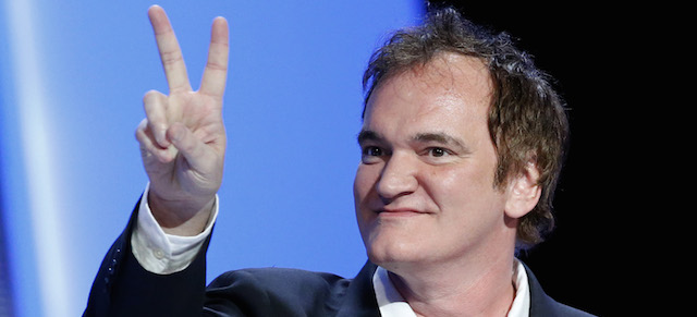 U.S director Quentin Tarantino gestures on the stage during the 39th Cesar Film Awards at Theatre du Chatelet in Paris, France, Friday, Feb. 28, 2014. (AP Photo/Jacques Brinon)