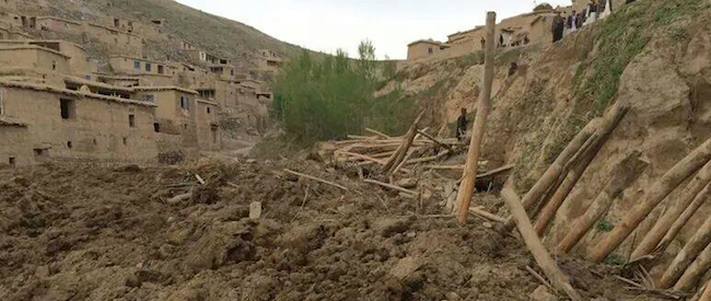 Afghans search for survivors after a massive landslide landslide buried a village Friday, May 2, 2014 in Badakhshan province, northeastern Afghanistan, which Afghan and U.N. officials say left hundreds of dead and missing missing.(AP Photo/Ahmad Zubair)