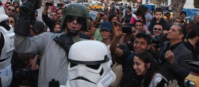 Star Wars fans wearing stormtrooper costumes parade along Tunis’ stately, tree-lined Bourguiba Avenue, in Tunisia, Wednesday, April 30, 2014. The empire was not striking back against the poster child for Arab democracy — just an innovative campaign to encourage tourists to return to this sunny desert-and-beach nation in North Africa. "We came here to Tunis to help save the Star Wars sites in Matmata and Tozeur and convince people to return to Tunisia," said Ingo Kaiser, head of a Star Wars fan club in Europe, referring to the movie sets that are slowly being covered up by sand in the Tunisian desert. (AP Photo/Aimen Zine)