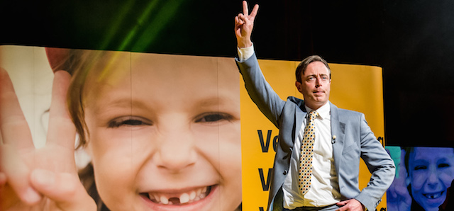 The leader of the NVA (New Flemish Alliance) Bart De Wever makes a victory sign as he arrives to address his party members after winning the Belgian federal and regional elections, in Brussels, Sunday May 25, 2014. (AP Photo/Geert Vanden Wijngaert)