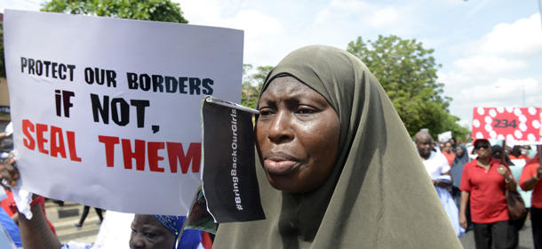 A woman chants slogans alongside members of Lagos based civil society groups holding a rally calling for the release of missing Chibok school girls at the state government house, in Lagos, Nigeria, on May 5, 2014. Boko Haram on Monday claimed the abduction of hundreds of schoolgirls in northern Nigeria that has triggered international outrage, threatening to sell them as "slaves". "I abducted your girls," the Islamist group's leader Abubakar Shekau said in the 57-minute video obtained by AFP, referring to the 276 students kidnapped from their boarding school in Chibok, Borno state, three weeks ago. AFP PHOTO / PIUS UTOMI EKPEI (Photo credit should read PIUS UTOMI EKPEI/AFP/Getty Images)