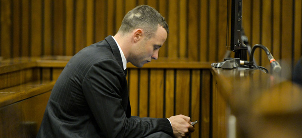 PRETORIA, SOUTH AFRICA - MAY 09: (SOUTH AFRICA OUT) Oscar Pistorius in the dock at the Pretoria High Court on May 9, 2014, in Pretoria, South Africa. Oscar Pistorius stands accused of the murder of his girlfriend, Reeva Steenkamp, on February 14, 2013. This is Pistorius' official trial, the result of which will determine the paralympian athlete's fate. (Photo by Herman Verwey-Pool/Getty Images)