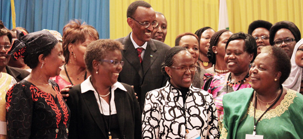In this May 17 , 2010 photo, Rwandan President Paul Kagame, center, takes part in a group photo at a conference on the role of women at the nation's parliament in Kigali, Rwanda. Rwandan officials say the country's parliament has a higher percentage of women than any other parliament in the world. More than 50 percent of the parliament's lower house are women. (AP Photo/Jason Straziuso)