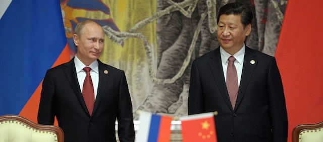 China's President Xi Jinping (R) and Russia's President Vladimir Putin attend an agreement signing ceremony in Shanghai on May 21, 2014. China and Russia signed today a monumental, multi-decade gas supply contract in Shanghai, Chinese state energy giant CNPC said, with reports saying it could be worth as much as $400 billion. AFP PHOTO / RIA-NOVOSTI / POOL ALEXEY DRUZHININ (Photo credit should read ALEXEY DRUZHININ/AFP/Getty Images)