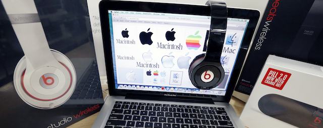 FILE - In this May 9, 2014 file photo, Beats Audio equipment is arranged for a photo next to an Apple laptop at Best Buy in Boston. Apple announced Wednesday, May 28, 2014, that it is acquiring Beats Electronics for $3 billion. Beats, the headphone and music streaming specialist, also brings the swagger of rapper Dr. Dre and recording impresario Jimmy Iovine. (AP Photo/Michael Dwyer, File)