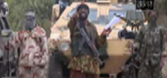 In this image made from video received by The Associated Press on Monday, May 5, 2014, Abubakar Shekau, the leader of Nigeria's Islamic extremist group Boko Haram, speaks in a video in which his group claimed responsibility for the April 15 mass abduction of nearly 300 teenage schoolgirls in northeast Nigeria. Shekau threatened to sell the nearly 300 teenage schoolgirls abducted from a school in the remote northeast three weeks ago, in a new videotape received Monday. It was unclear if the video was made before or after reports emerged last week that some of the girls have been forced to marry their abductors — who paid a nominal bride price of $12 — and that others have been carried into neighboring Cameroon and Chad. Those reports could not be verified. (AP Photo)