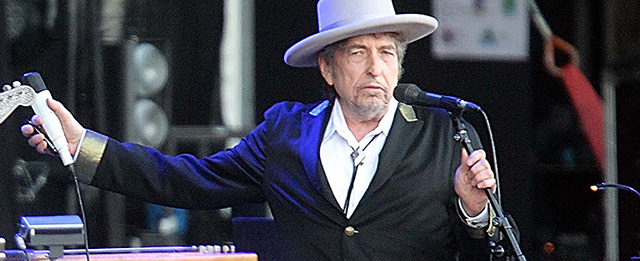FILE - This July 22, 2012 file photo shows U.S. singer-songwriter Bob Dylan performing on stage at "Les Vieilles Charrues" Festival in Carhaix, western France. French authorities have filed preliminary charges against Bob Dylan over an interview in which he is quoted comparing Croatians to Nazis and the Ku Klux Klan. Paris prosecutor’s office spokeswoman Agnes Thibault-Lecuivre said Monday the charges of “public insult and inciting hate” were filed in mid-November.The charges stemmed from a lawsuit by a Croatian advocacy group in France over an interview in Rolling Stone magazine in 2012. (AP Photo/David Vincent, file)