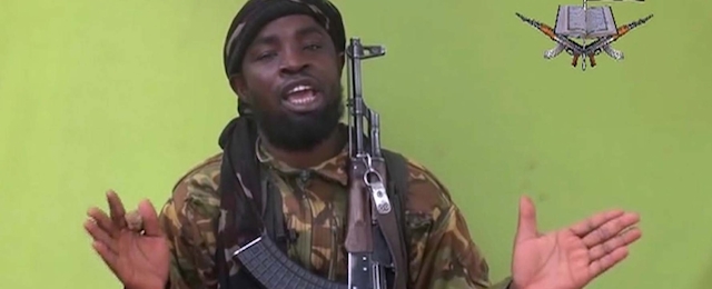 In this photo taken from video by Nigeria's Boko Haram terrorist network, Monday May 12, 2014 shows their leader Abubakar Shekau speaking to the camera. The new video purports to show dozens of abducted schoolgirls, covered in jihab and praying in Arabic. It is the first public sight of the girls since more than 300 were kidnapped from a northeastern school the night of April 14 exactly four weeks ago. (AP Photo)