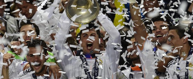 Real Madrid's Portuguese forward Cristiano Ronaldo (C) and teammates celebrate with the trophy at the end of the UEFA Champions League Final Real Madrid vs Atletico de Madrid at Luz stadium in Lisbon, on May 24, 2014. Real Madrid won 4-1. AFP PHOTO/ JAVIER SORIANO (Photo credit should read JAVIER SORIANO/AFP/Getty Images)