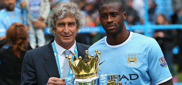 MANCHESTER, ENGLAND - MAY 11: The Manchester City Manager Manuel Pellegrini and Yaya Toure pose with the trophy at the end of the Barclays Premier League match between Manchester City and West Ham United at the Etihad Stadium on May 11, 2014 in Manchester, England. (Photo by Alex Livesey/Getty Images)