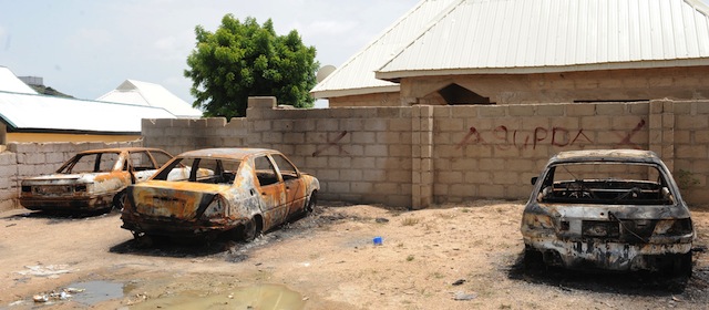 Three cars have been burnt by unidentified gunmen at atTudunwada district, Mubi in northeastern State of Adamawa on October 5, 2012 . Twenty-seven students of the Federal Polytechnic, among other non-students, were last Monday massacred in their abode by yet-to-be identified gunmen in a night attack . AFP PHOTO/PIUS UTOMI EKPEI

 
 (Photo credit should read PIUS UTOMI EKPEI/AFP/GettyImages)