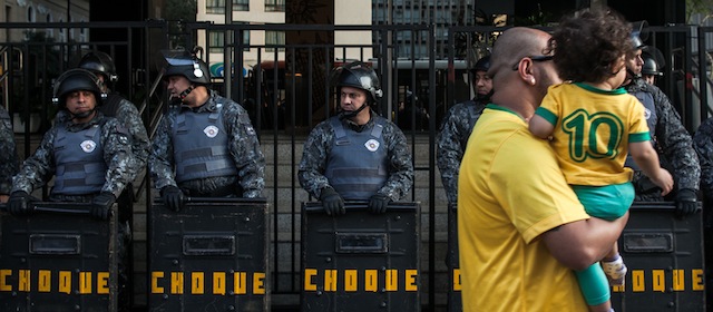 SAO PAULO, BRAZIL - JUNE 23, 2014: Members of the group "will not have Cup" protest against the holding of the World Cup in Brazil and overspending in the construction of stadiums during the game between Brazil and Cameroon, Monday, June 23, 2014 in Sao Paulo Brazil. The protesters were accompanied by strong policing and demanded the end of the World Cup in the country.(Photo by Victor Moriyama/Getty Images)