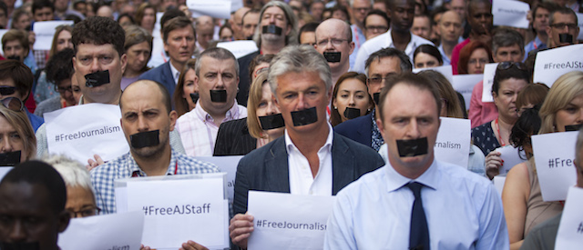 LONDON, ENGLAND - JUNE 24: The BBC's Director of News and Current Affairs, James Harding (R), joins staff and colleagues from other news organisations in a one-minute silent protest outside New Broadcasting House against the seven-year jail terms given to three al-Jazeera journalists in Egypt on June 24, 2014 in London, England. A court in Cairo found al-Jazeera's Cairo bureau chief, Mohamed Fahmy, who is Canadian-Egyptian, Egyptian producer Baher Mohamed and Australian correspondent Peter Greste guilty of spreading false news. (Photo by Rob Stothard/Getty Images)