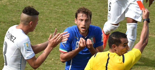 Italy's midfielder Claudio Marchisio(C) reacts as he is shown a red card by Mexican referee Marco Antonio Rodriguez Moreno during a Group D football match between Italy and Uruguay at the Dunas Arena in Natal during the 2014 FIFA World Cup on June 24, 2014. AFP PHOTO/ YASUYOSHI CHIBA