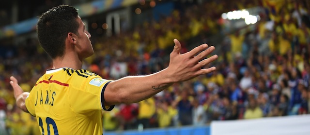 Colombia's midfielder James Rodriguez celebrates after scoring Colombia's fourth goal during the Group C football match between Japan and Colombia at the Pantanal Arena in Cuiaba during the 2014 FIFA World Cup on June 24, 2014. AFP PHOTO / TOSHIFUMI KITAMURA