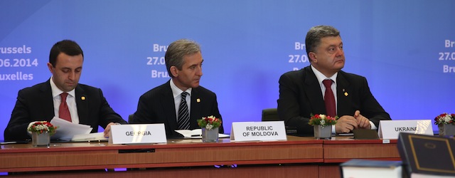 (From L) Georgia's Prime Minister Irakli Garibashvili, Moldovan Prime Minister Iurie Leanca and Ukrainian President Petro Poroshenko attend the second day of the EU summit on June 27, 2014 at the EU headquarters in Brussels. The European Union on June 27 signed association accords with Ukraine, Georgia and Moldova as the three former Soviet republics committed themselves to a future in Europe. AFP PHOTO / POOL / OLIVIER HOSLET (Photo credit should read OLIVIER HOSLET/AFP/Getty Images)
