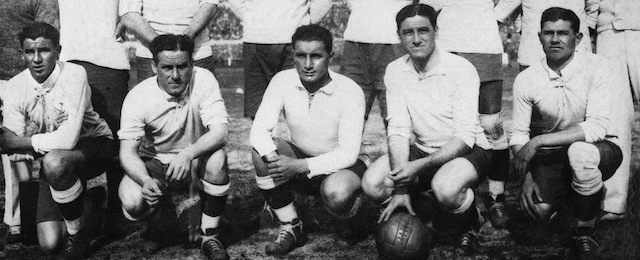 MONTEVIDEO, URUGUAY - JULY 30: The Uruguayan national soccer team players pose for a group picture, 30 July 1930 in Montevideo, after their victory over Argentina (4-2) in the first-ever World Cup final. (Standing, from L: Figoli (masseur), Alvaro Gestido, Jose Nazazzi, Enrique Ballesteros, Ernesto Mascheroni, Jose Leandro Andrade, Lorenzo Fernandez, Greco (masseur); front row, from L : Pablo Dorado, Hector Scarone, Hector Castro, Jose Pedro Cea, Santos Iriarte) (Photo credit should read STAFF/AFP/Getty Images)