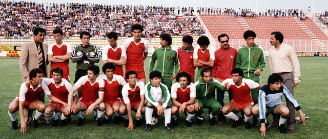 A family picture shows the Algerian team selected for the 1982 World Cup in Spain. The Algerian team who will face West Germany, Austria and Chile ine the second group of the Mundial, trained on January 6, 1982 in Tours against the town's team. The most important players of this selection are: Mustapha Dalheb (back row, 2nd R), Nordine Kourichi (back row, 5th L), Lakhdar Belloumi (front row, 5th L), Abdel Djadaoui (front row, 3rd R). AFP PHOTO YOLANDE MIGNOT (Photo credit should read YOLANDE MIGNOT/AFP/Getty Images)