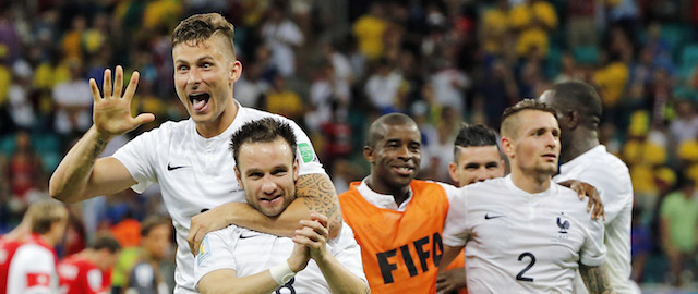 France's Olivier Giroud, left, and Mathieu Valbuena celebrate after the group E World Cup soccer match between Switzerland and France at the Arena Fonte Nova in Salvador, Brazil, Friday, June 20, 2014. The match ended in a 5-2 win for France. (AP Photo/David Vincent)