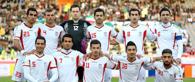Iran's national soccer team poses for a picture prior to their friendly match with Guinea, at the Azadi (Freedom) stadium in Tehran, Iran, Wednesday, March 5, 2014. Guinea won the match 2-1. Standing from left: Mehrdad Pouladi, Jalal Hosseini, Daniel Davari, Pejman Montazeri, Mojtaba Jabari, Javad Nekounam, Seated from left: Amir Hossein Sadeghi, Masoud Shojaei, Ghasem Hadadifard, Reza Ghouchannejad, Ashkan Dejagah (AP Photo/Ebrahim Noroozi)