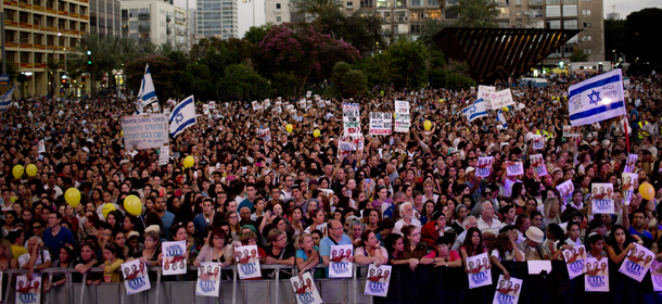 Thousands of Israelis gather for a rally calling for the release of the three missing Israeli teens, feared abducted in the West Bank on June 12, in Tel Aviv, Israel, Sunday, June 29, 2014. There has been an increase in rockets launched from the Hamas-ruled territory toward Israel this month, as the army has carried out a wide-ranging operation against Hamas in the West Bank while searching for three Israeli teens who Israel says were abducted by the Palestinian militant group. (AP Photo/Oded Balilty)