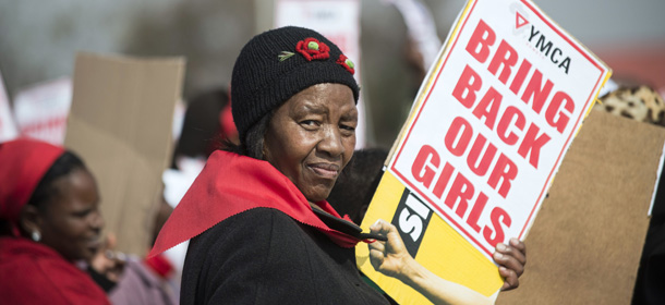 A woman hold a placard as hundreds of Soweto residents march at the YMCA in Soweto, Johannesbourg, on May 22, 2014, to demonstrate for the release of more than 200 schoolgirls kidnapped by Islamist militant group Boko Haram in Nigeria. The United States has deployed 80 military personnel to Chad to help findthe 223 girls still missing since their abduction on April 14, 2014. AFP PHOTO/ MUJAHID SAFODIEN (Photo credit should read MUJAHID SAFODIEN/AFP/Getty Images)