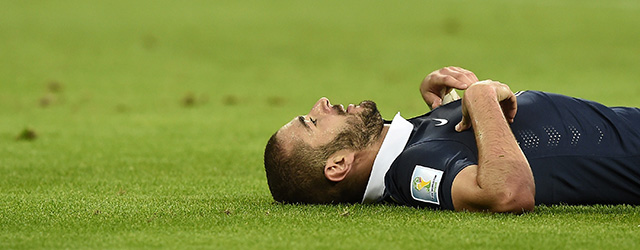 France's forward Karim Benzema lies on the pitch during the Group E football match between France and Honduras at the Beira-Rio Stadium in Porto Alegre on June 15, 2014, during the 2014 FIFA World Cup. AFP PHOTO / FRANCK FIFE