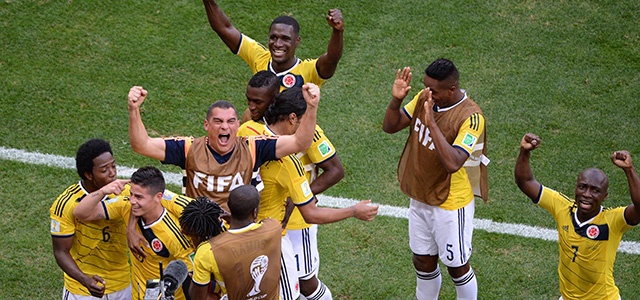 Colombia's players celebrate after scoring a goal during the Group C football match between Colombia and Ivory Coast at the Mane Garrincha National Stadium in Brasilia during the 2014 FIFA World Cup on June 19, 2014. AFP PHOTO / EVARISTO SA