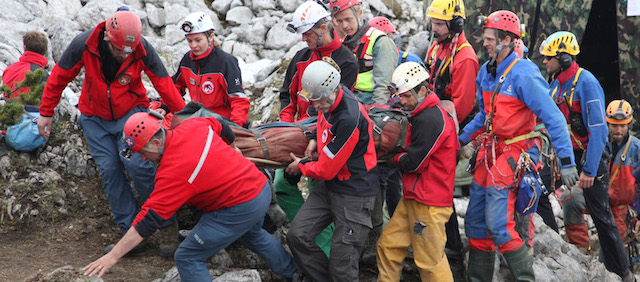 MARKTSCHELLENBERG, GERMANY - JUNE 19: In this handout photo provided by the Bavarian Mountain Patrol (Bergwacht Bayern), rescue workers carry injured spelunker Johann Westhauser after they brought him to the surface from the Riesending vertical cave during the final phase of his rescue on June 19, 2014 near Marktschellenberg, Germany. Westhauser received a severe head injury when he was struck by rocks in the cave on June 8, 1,000 meters below the surface, and since then over 700 rescue workers from Germany, Italy, Switzerland, Austria and Croatia have been working around the clock in an arduous effort to save him. Westhauser was among explorers who first discovered the cave, which is over 20 kilometers long, in 1995. (Photo by Bergwacht Bayern via Getty Images)
