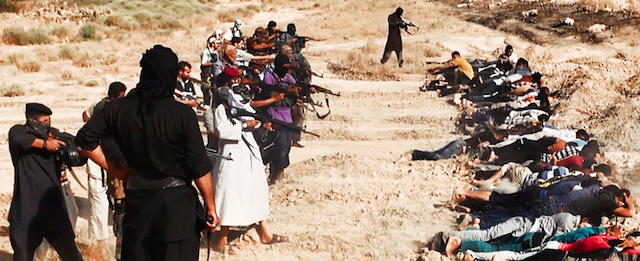 This image posted on a militant website on Saturday, June 14, 2014, which has been verified and is consistent with other AP reporting, appears to show militants from the al-Qaida-inspired Islamic State of Iraq and the Levant (ISIL) taking aim at captured Iraqi soldiers wearing plain clothes after taking over a base in Tikrit, Iraq. The Islamic militant group that seized much of northern Iraq has posted photos that appear to show its fighters shooting dead dozens of captured Iraqi soldiers in a province north of the capital Baghdad. Iraq's top military spokesman Lt. Gen. Qassim al-Moussawi confirmed the photos’ authenticity on Sunday and said he was aware of cases of mass murder of Iraqi soldiers. (AP Photo via militant website)