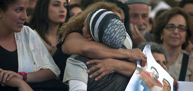 TEL AVIV, ISRAEL - JUNE 29: (ISRAEL OUT) An Israeli woman hugs Iris Yifrah (from the back), mother of kidnapped Israeli teenager Eyal Yifrah During a rally under the slogan 'Bring Our Boys Home' on June 29, 2014 in Tel Aviv, Israel.Thousands of people gathered in Tel Aviv's Rabin Square on Sunday evening for a rally calling for the release of the three Israeli teens who were kidnapped more than two weeks ago. (Photo by Lior Mizrahi/Getty Images)