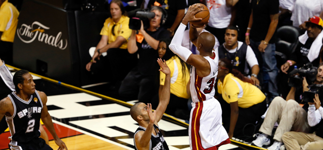 MIAMI, FL - JUNE 18: Ray Allen #34 of the Miami Heat makes a game-tying three-pointer over Tony Parker #9 of the San Antonio Spurs in the fourth quarter during Game Six of the 2013 NBA Finals at AmericanAirlines Arena on June 18, 2013 in Miami, Florida. NOTE TO USER: User expressly acknowledges and agrees that, by downloading and or using this photograph, User is consenting to the terms and conditions of the Getty Images License Agreement. (Photo by Kevin C. Cox/Getty Images)