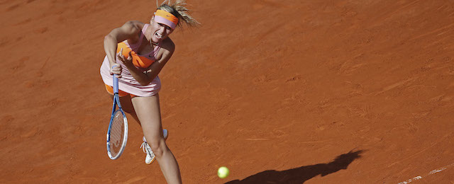 Russia's Maria Sharapova returns the ball during final of the French Open tennis tournament against Romania's Simona Halep at the Roland Garros stadium, in Paris, France, Saturday, June 7, 2014. (AP Photo/David Vincent)