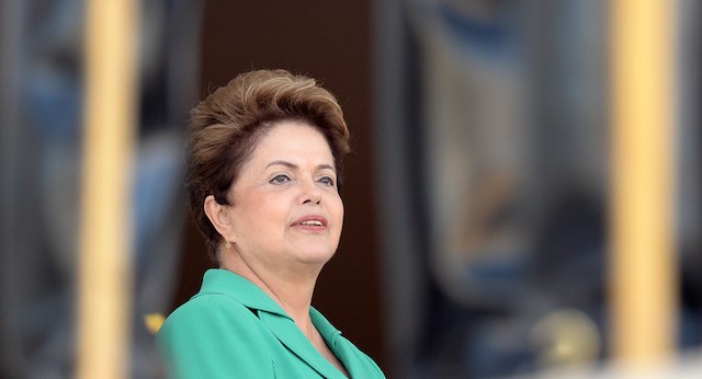 Brazil's President Dilma Rousseff waits the arrival of her Chilean counterpart Michelle Bachelet at the Planalto Palace in Brasilia on 12 June, 2014. Rousseff and Bachelet will attend in the afternoon the FIFA World Cup Brazil 2014 opening match between Brazil and Croatia at the Corinthias Arena in Sao Paulo. AFP PHOTO / Evaristo SA (Photo credit should read EVARISTO SA/AFP/Getty Images)