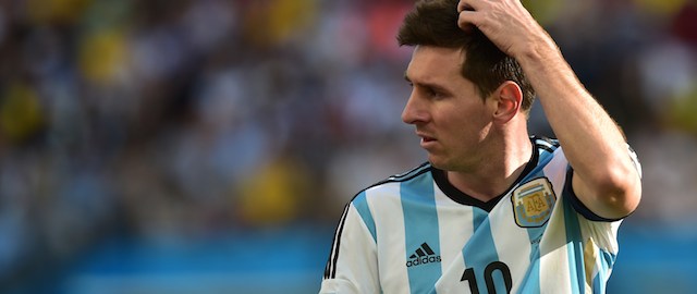 Argentina's forward and captain Lionel Messi reacts during a Round of 16 football match between Argentina and Switzerland at Corinthians Arena in Sao Paulo during the 2014 FIFA World Cup on July 1, 2014. AFP PHOTO / NELSON ALMEIDA