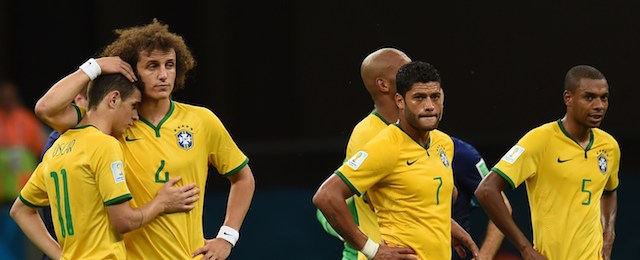 (L-R) Brazil's midfielder Oscar, Brazil's defender David Luiz, Brazil's forward Hulk and Brazil's midfielder Fernandinho react at the end of the third place play-off football match between Brazil and Netherlands during the 2014 FIFA World Cup at the National Stadium in Brasilia on July 12, 2014. Netherlands won 3-0. AFP PHOTO / VANDERLEI ALMEIDA