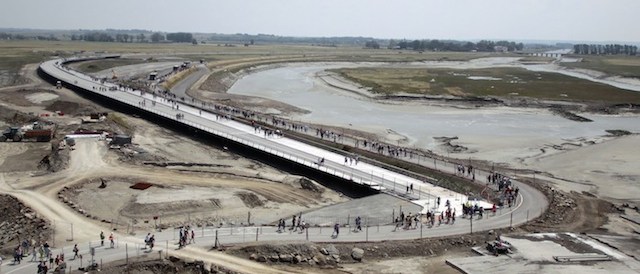 People walk on a newly opened footbridge that leads to Mont Saint-Michel, north-western France, on July 22, 2014. AFP PHOTO / CHARLY TRIBALLEAU (Photo credit should read CHARLY TRIBALLEAU/AFP/Getty Images)