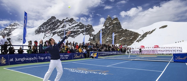 IMAGE DISTRIBUTED FOR LINDT – Switzerland’s champion tennis player Roger Federer and US champion ski racer Lindsey Vonn played an exhibition tennis match on the Aletsch Glacier below the Sphinx Summit to celebrate the opening of the LINDT Swiss Chocolate Heaven, a shop at 3,454 metres above sea level on Jungfraujoch, Switzerland, on Tuesday, July 16, 2014. The themed chocolate shop, which offers a wide range of the finest LINDT chocolate and the adjacent Master Chocolatiers parlor gives visitors a insight into how chocolate is made, was opened by Roger Federer and is collaboration between Swiss chocolate maker Lindt & Sprüngli and Jungfrau Railway Holding AG. (Alexandra Wey for LINDT via AP Images)